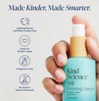 Hand holding a Kind Science firming serum bottle with product features listed on a white background.