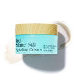 Kind Science Hydration Cream jar with wooden lid with a swatch of the product