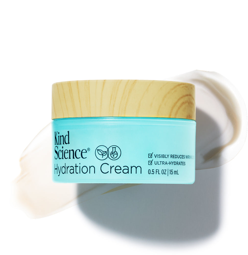 Kind Science Hydration Cream jar with wooden lid with a swatch of the product