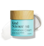 Kind Science Hydration Cream jar with wooden lid on a white background with a swatch of the product