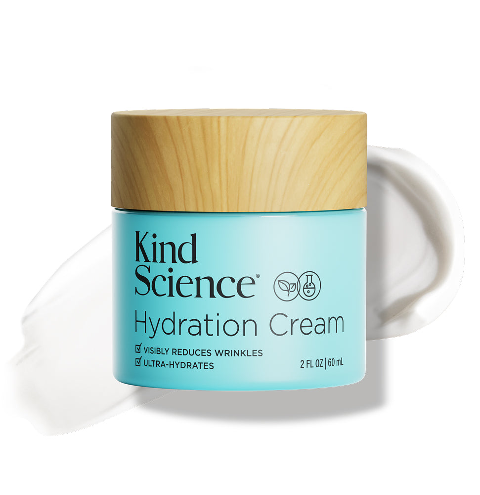 Kind Science Hydration Cream jar with wooden lid on a white background with a swatch of the product