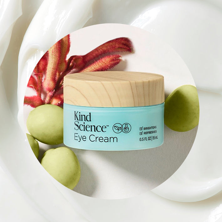 Kind Science Eye Cream jar with a wooden featuring Power Peptides, Kakadu Plum and Hyaluronic Acid in background