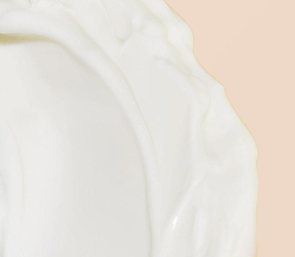 Close-up of Firming Serum on beige background 