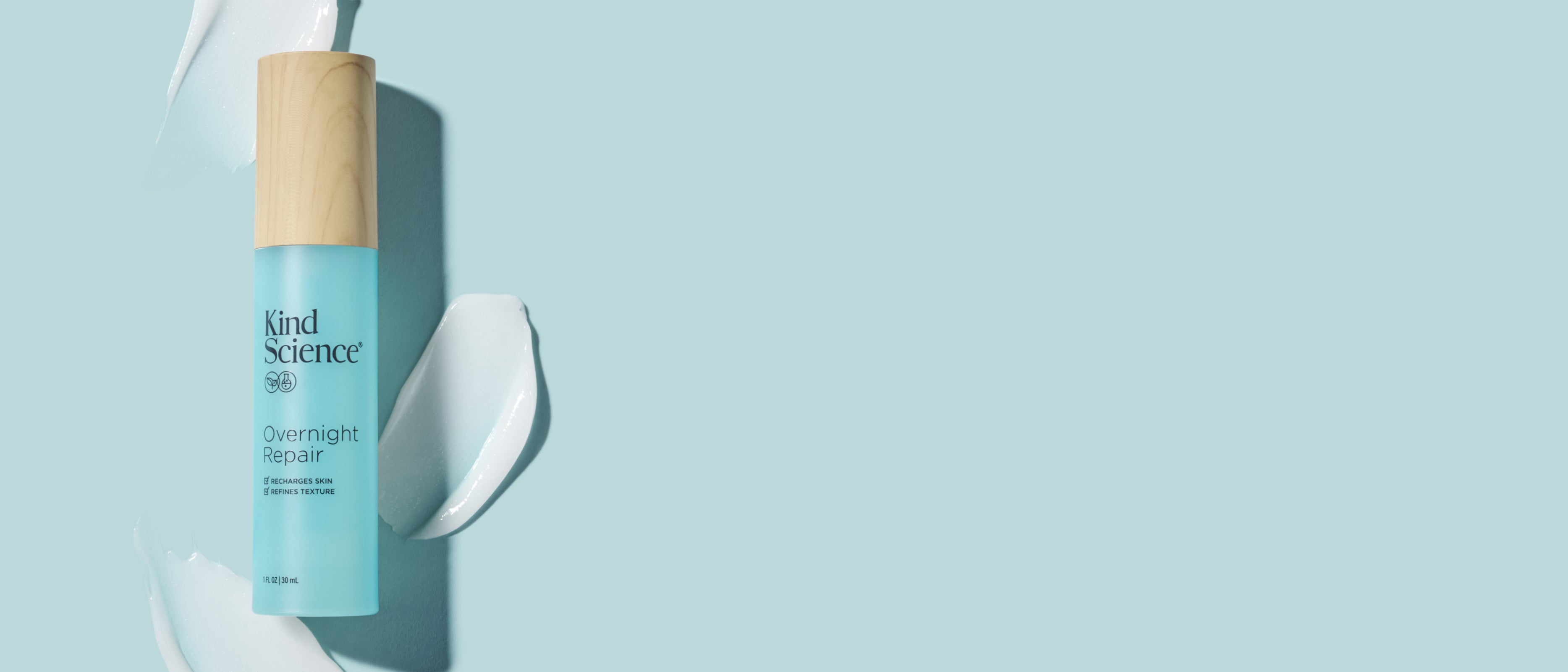 Kind Science Overnight Repair bottle with a wooden cap on a light blue background