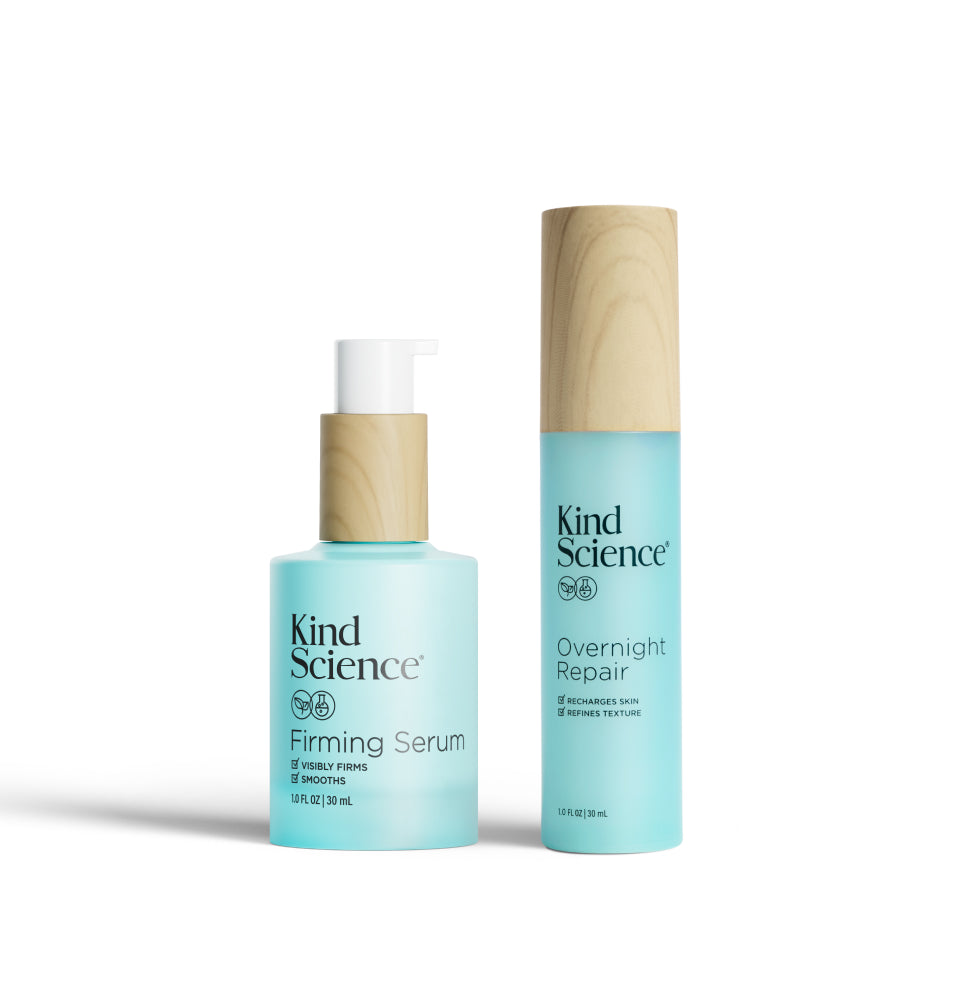 Two bottles of Kind Science skincare products on a white background