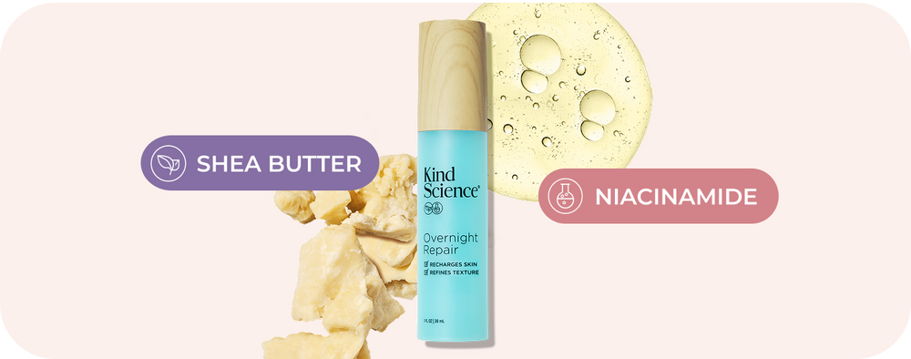 Kind Science Overnight Repair night cream bottle with a light blue body and beige cap, flanked by shea butter chunks on the left and a round niacinamide graphic on the right, with purple and pink labels on a pale pink background.