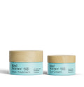 Two jars of Kind Science skincare products on a white background
